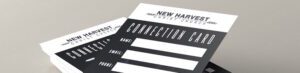Close-up of stacked Church Connection Cards for "New Harvest Christ Church." Each card features sections for name, email, and phone number. The black and white design offers a modern, clean look to help your church reach more people effectively.