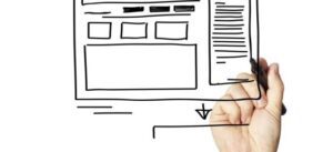 A hand is drawing a wireframe sketch on a transparent surface, depicting a church website layout. The design includes a main header, three square placeholders for questions and answers, a large rectangle for content, and a sidebar with lines to indicate text.
