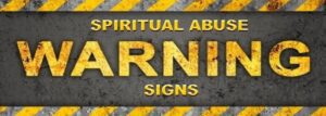 Image of a distressed black background with yellow and black caution stripes along the top and bottom. Bold yellow text in the center reads "SPIRITUAL WARNING SIGNS.