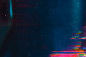 Abstract digital artwork featuring streaks and lines in blue, red, and green tones. The image has a glitchy, choppy distortion effect reminiscent of interrupted video feed, creating a dynamic and vibrant feel.