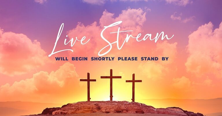 Sunset background with pink and orange clouds. Three crosses stand on a rocky hill, symbolizing the essence of an Easter Service. Bold white text reads, "Live Stream Will Begin Shortly. Please Stand By.